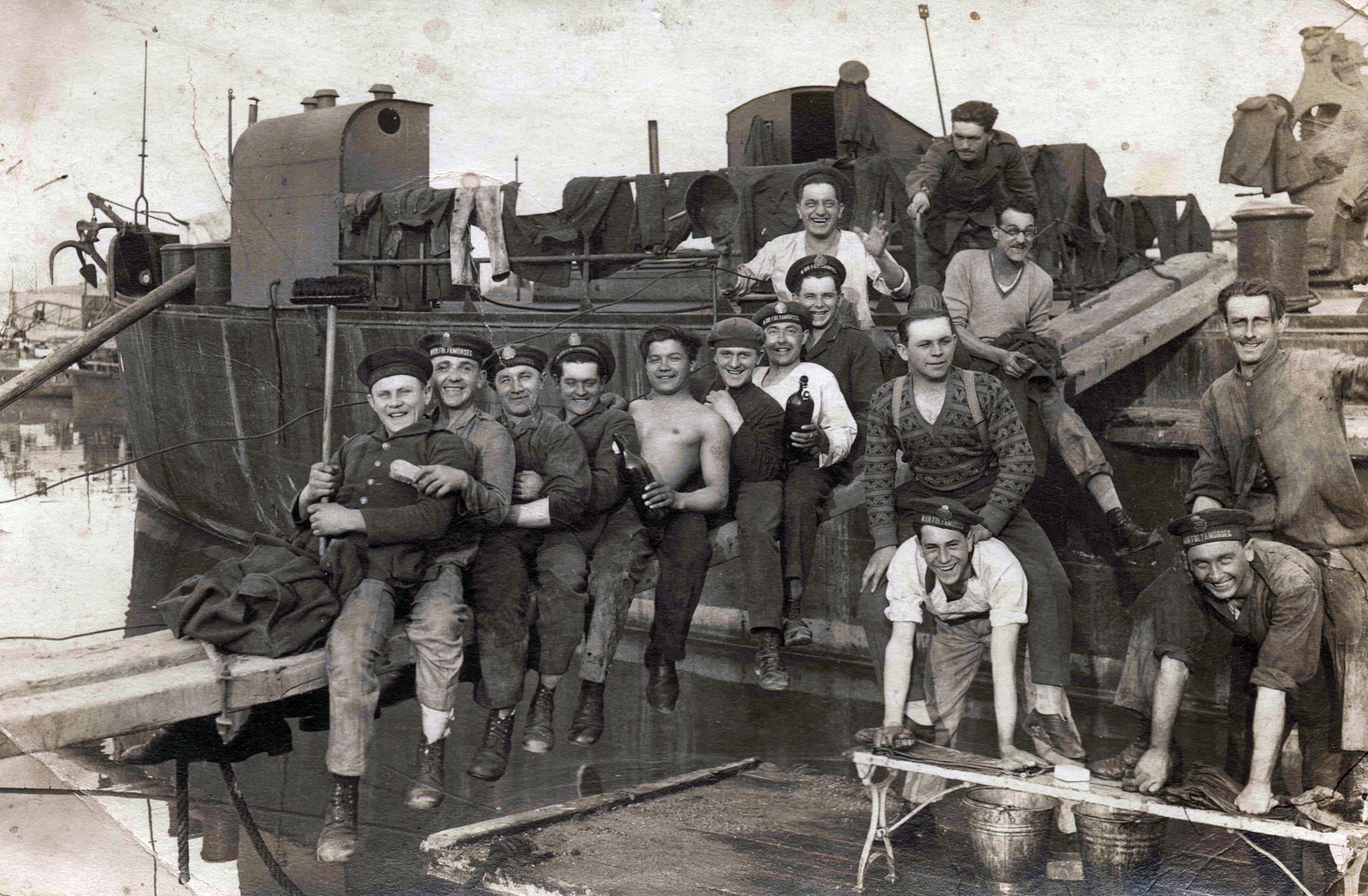 Hungary, a Magyar Királyi Folyamőrség matrózai., 1928, Beták Róbert, ship, tableau, smile, men, jesting, fun, cap, crest, port, bucket, hanging clothes, brush, bottle, anchor, river guard, plank, cleaning, mooring bollard, half-naked, wide sitting, sitting on the back of a man, Fortepan #100492