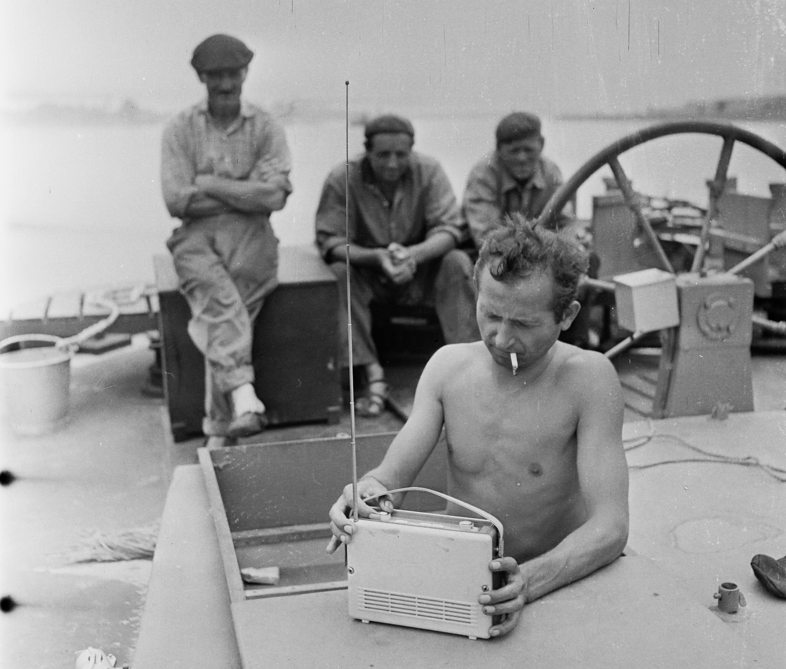 Hungary, a Folyamszabályozó és Kavicskotró Vállalat FK 127 nevű kotróhajója a Dunán., 1964, Bauer Sándor, portable radio, half-naked, Orionton-brand, arms crossed over the chest, steering wheel, Fortepan #109295