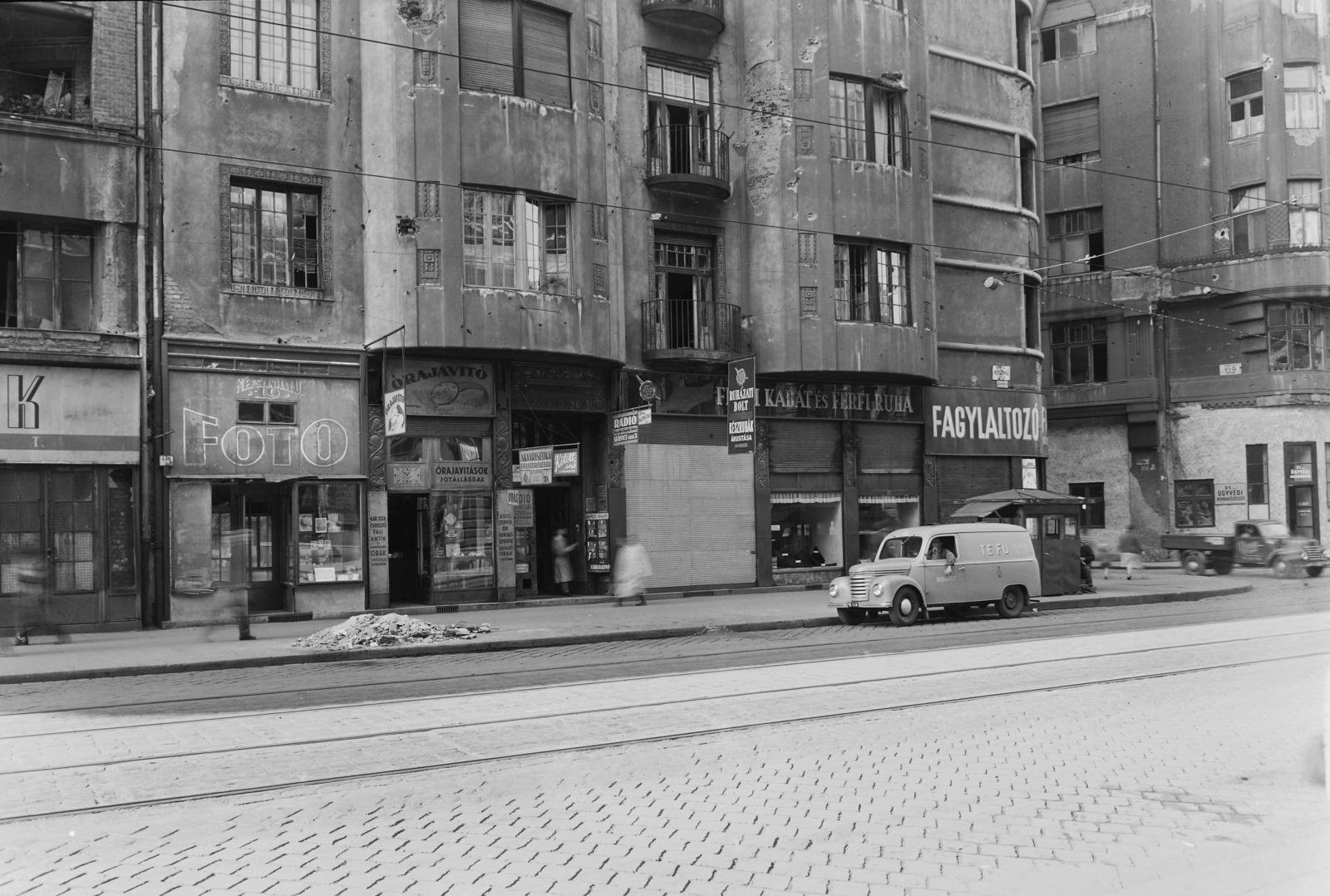 Hungary, Budapest VIII., Népszínház utca - Víg utca sarok., 1957, UVATERV, sign-board, Framo-brand, photographer, clockmaker, clothing store, Budapest, ice cream, Fortepan #12793