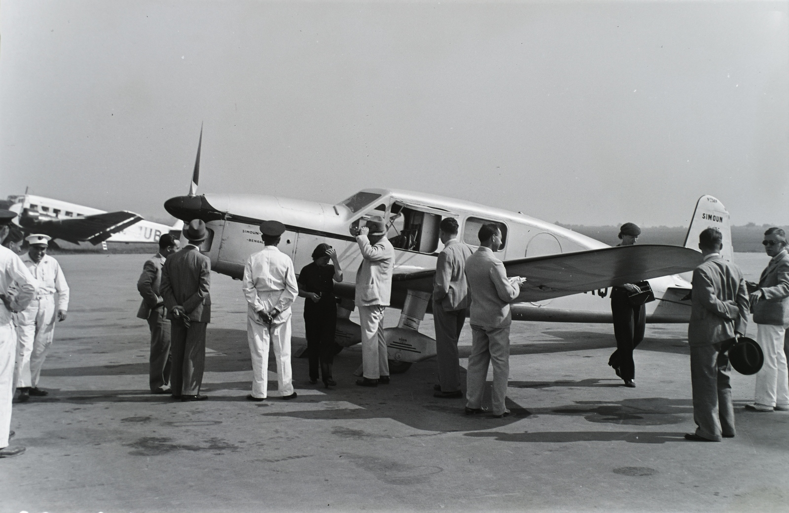 Hungary, Budaörs Airport, Budapest XVI., francia Caudron Simoun típusú, 4 üléses, 130 LE-s Renault motorral készült túrarepülőgép. Balra a háttérben a Malert HA-DUR Ju 52 típusú utasszállító repülőgépe. Leltári jelzet: 29155, 1937, Magyar Műszaki és Közlekedési Múzeum / Archívum / Negatívtár / Kolbányi Géza gyűjteménye, airplane, Renault-brand, Junkers-brand, Budapest, registration mark, Caudron-brand, Fortepan #132870