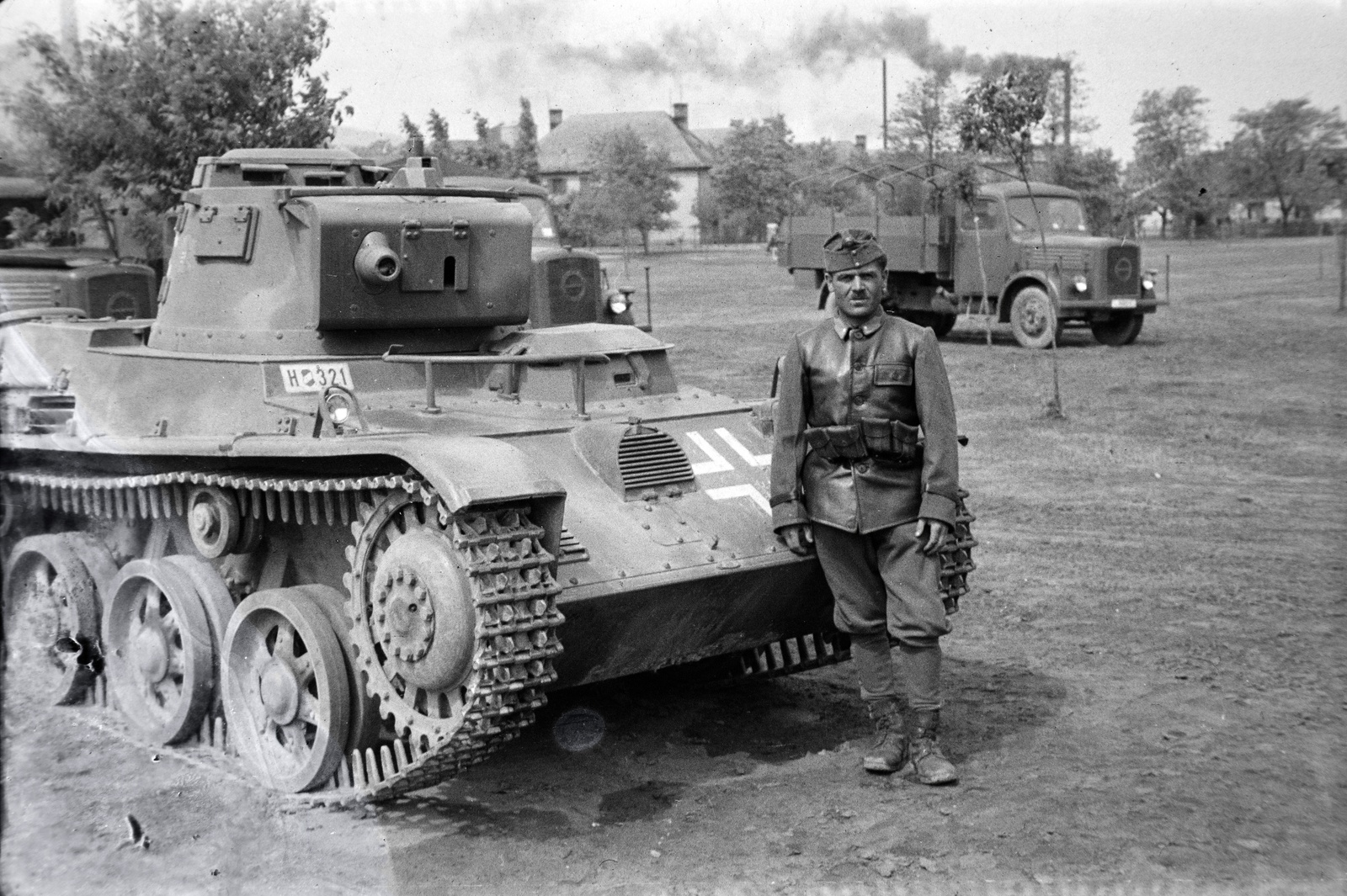 Hungary, Dorog, Otthon tér, háttérben a Brikettgyár utca., 1942, Miklós Lajos, leather jacket, number plate, insignia, Fortepan #140952