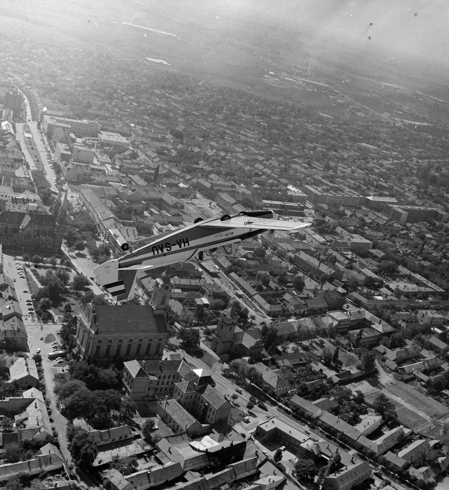 Hungary, Békéscsaba, Zlin-526F Trener típusú repülőgép a város felett., 1974, MHSZ, transport, Czechoslovak brand, aerial photo, airplane, Zlin-brand, aerobatic flying, registration mark, Fortepan #15294