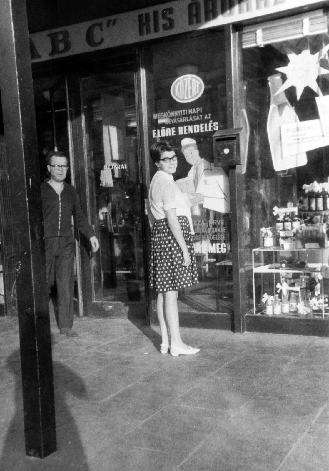 Hungary, Budapest XI., Irinyi József utca 34., 1969, Orosz Heléna, portrait, Show window, glasses, letter box, lady, skirt, Budapest, blouse, grocery store, Közért Company, poster, dotted dress, Fortepan #15517