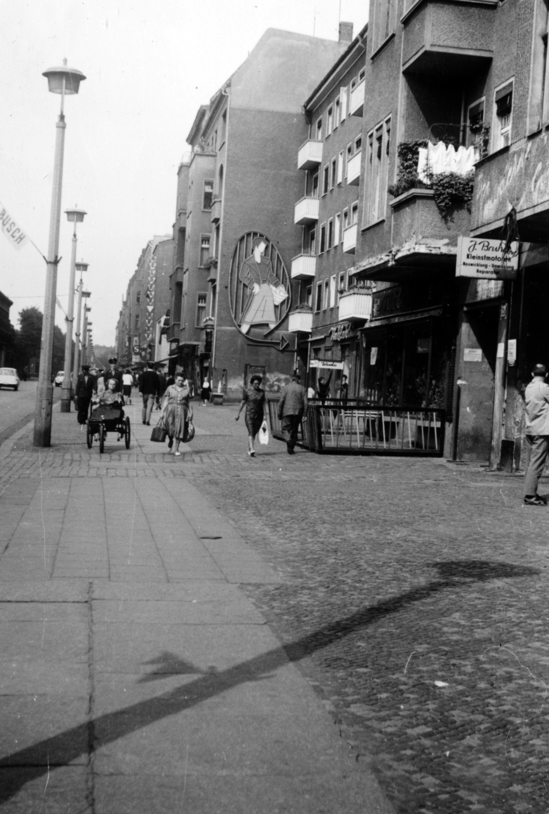 Germany, Berlin, Kelet-Berlin, a Schönhauser Allee a 72. számtól a Wichertstrasse felé nézve., 1965, Korda Judit, GDR, East-Berlin, neon sign, disabled, wheelchair, Fortepan #161854