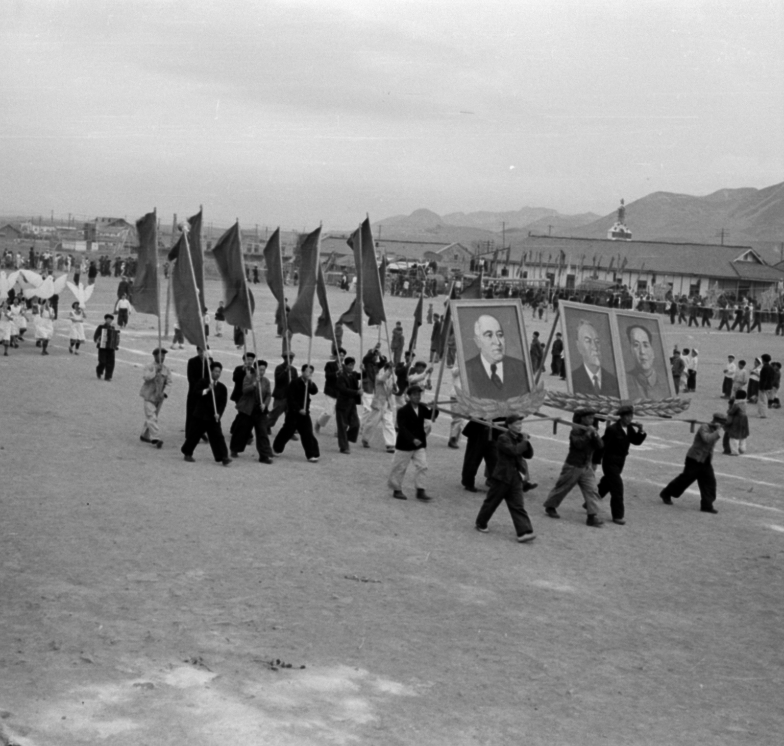 Democratic People's Republic of Korea, Sariwon, május 1-i felvonulás., 1955, Lőrinczi Ákos, photo aspect ratio: square, political decoration, carrying on the shoulder, Mátyás Rákosi-portrayal, Fortepan #170473