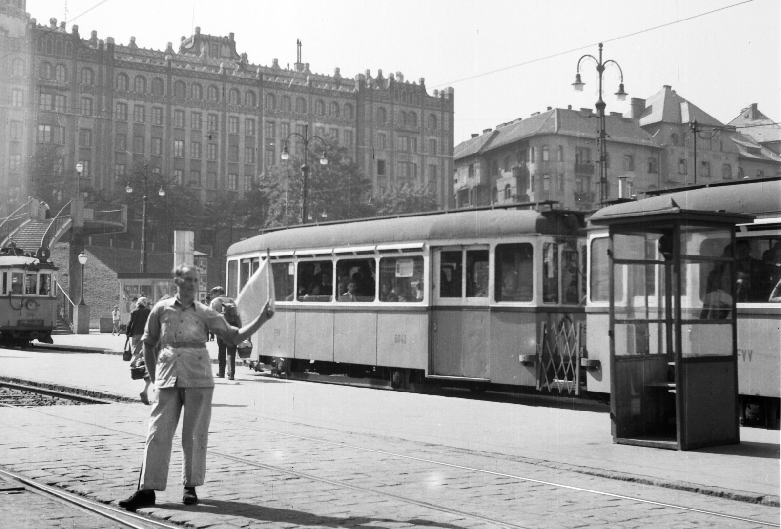 Hungary, Budapest XII.,Budapest II., Széll Kálmán (Moszkva) tér, háttérben a Postapalota., 1958, Székács András, street view, genre painting, tram, stairs, lamp post, points operator, Budapest, post office, FVV-organisation, Gyula Sándy-design, directing traffic, public transport line number, Fortepan #18160