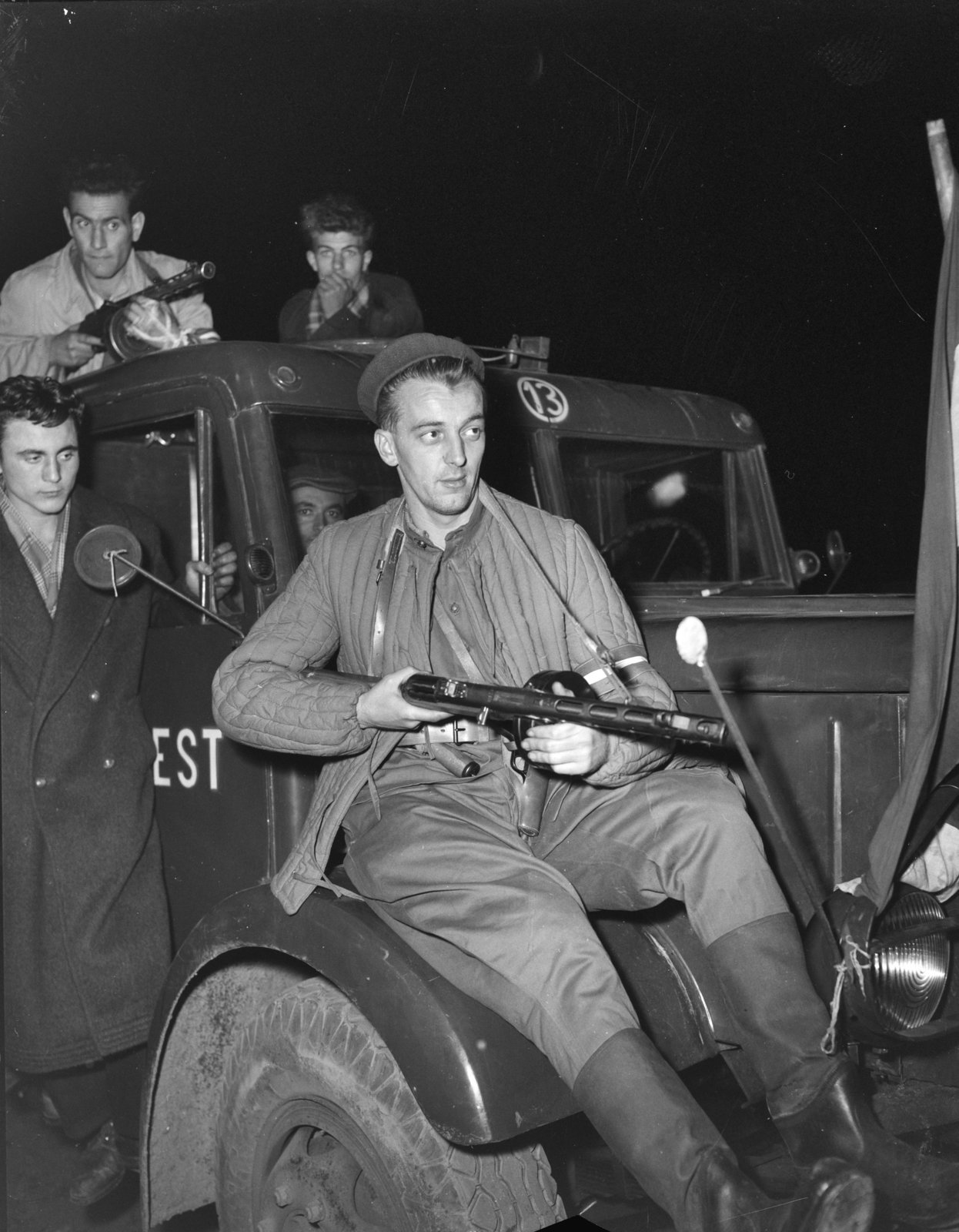 Hungary, Budapest, 1956, Spaarnestad Photo, boys, posture, weapon, quilted coat, sitting on a car, Fortepan #188221