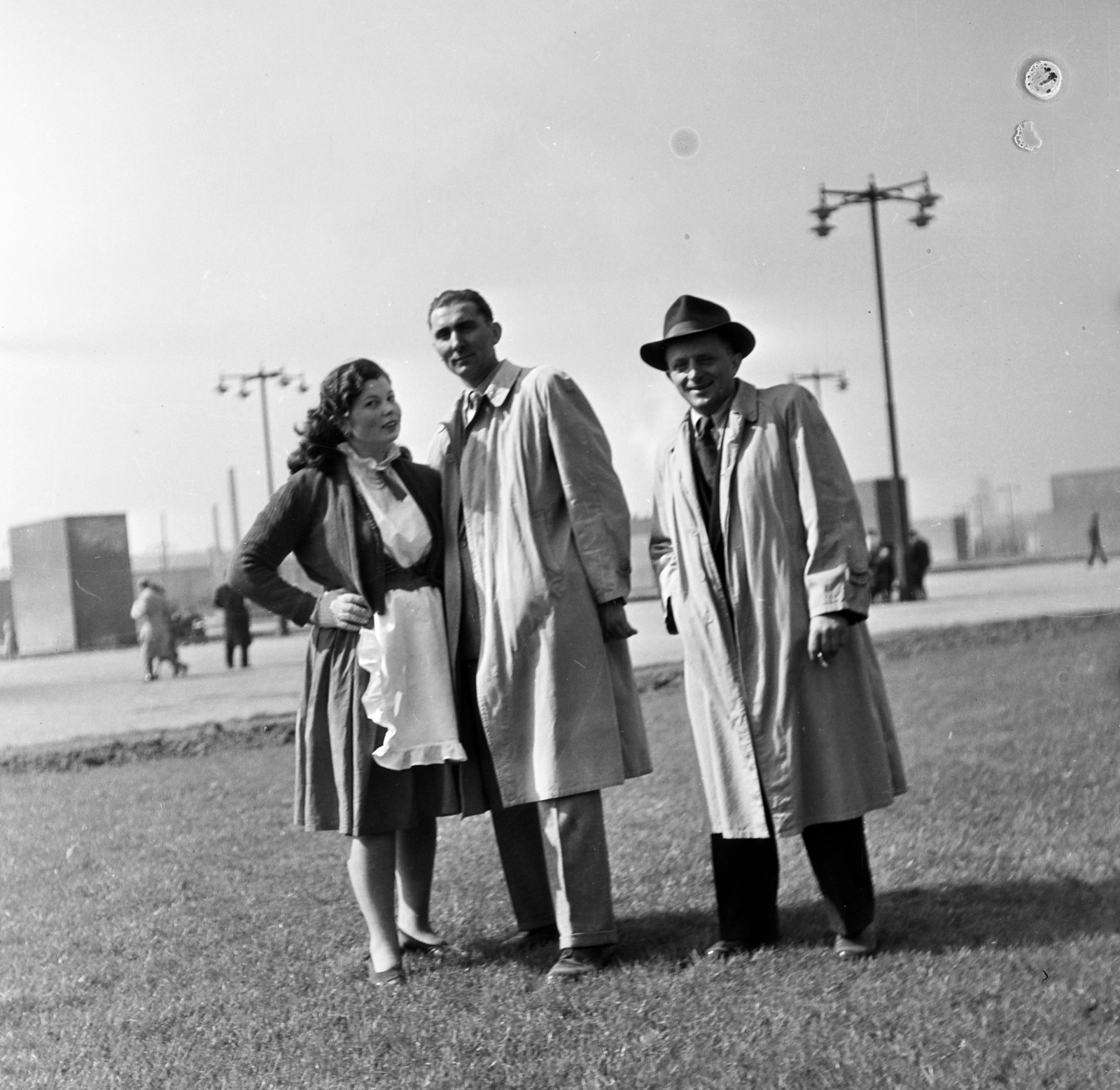 Hungary, Népstadion, Budapest XIV., 1955, Keveházi János, Budapest, photo aspect ratio: square, apron, posture, trench coat, three people, Fortepan #197245