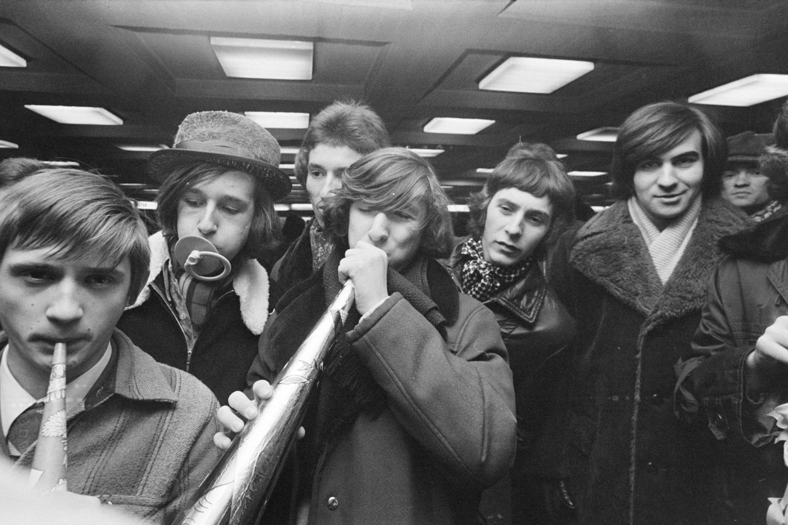 Hungary, Budapest VIII.,Budapest VII., szilveszterezők a Blaha Lujza téri aluljáróban., 1977, Kereki Sándor, Budapest, paper trumpet, pacifier, boys, youth, Fortepan #205812