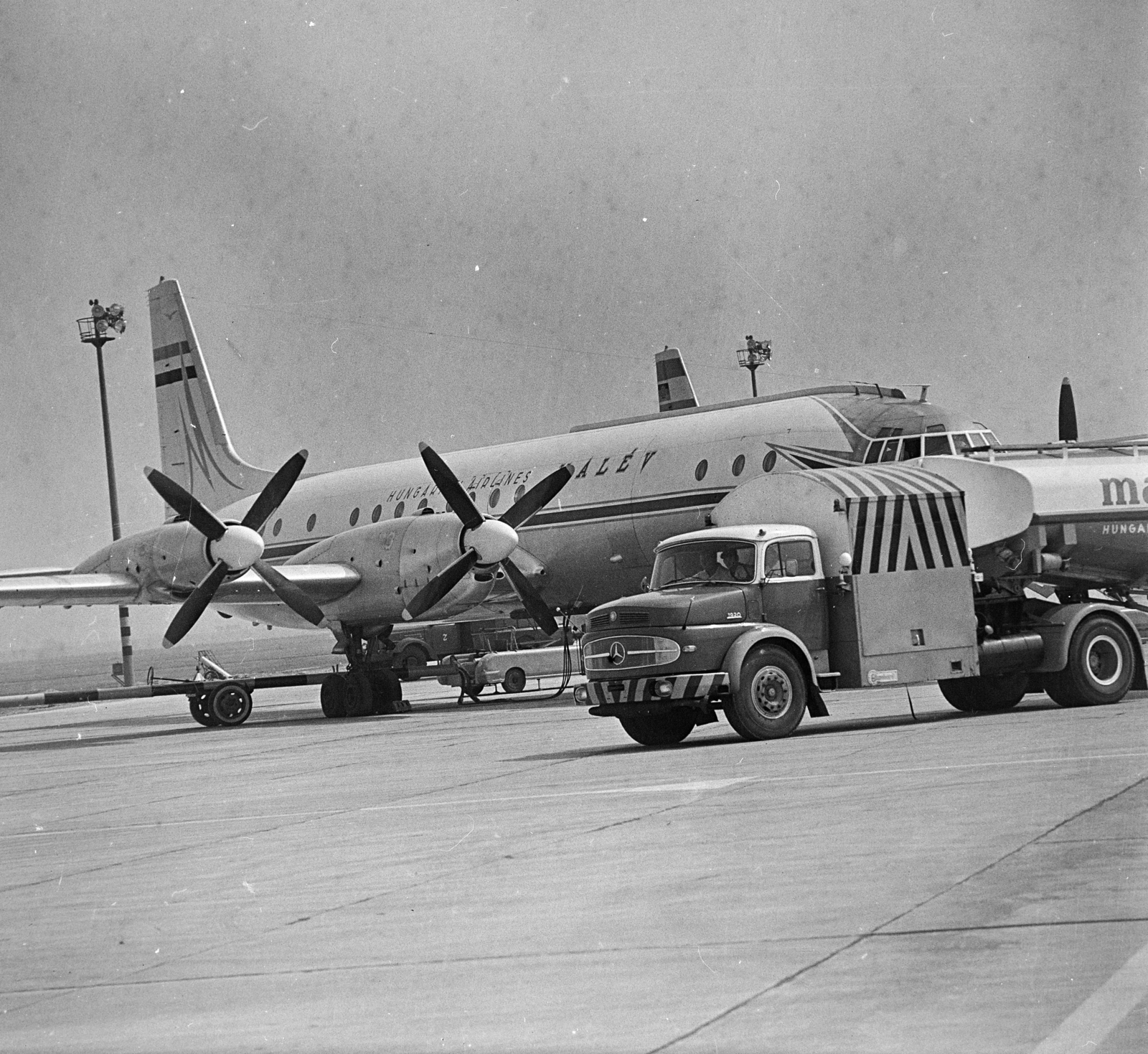 Hungary, Ferihegy (now - Ferenc Liszt) International Airport, Budapest XVIII., MALÉV IL-18- as repülőgép., 1966, MHSZ, transport, vehicle, airplane, Mercedes-brand, airport, Ilyushin-brand, Hungarian Airlines, Budapest, Mercedes L-series, Fortepan #22191