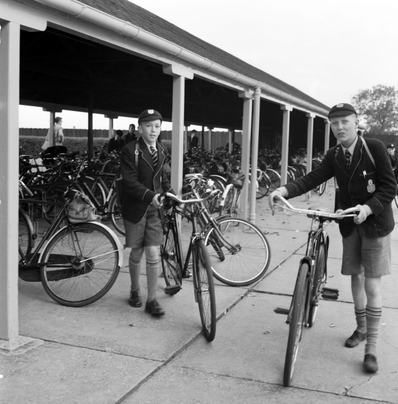 United Kingdom, 1956, UWM Libraries, bicycle holder, photo aspect ratio: square, caps, school uniform, bicycle, Fortepan #258837