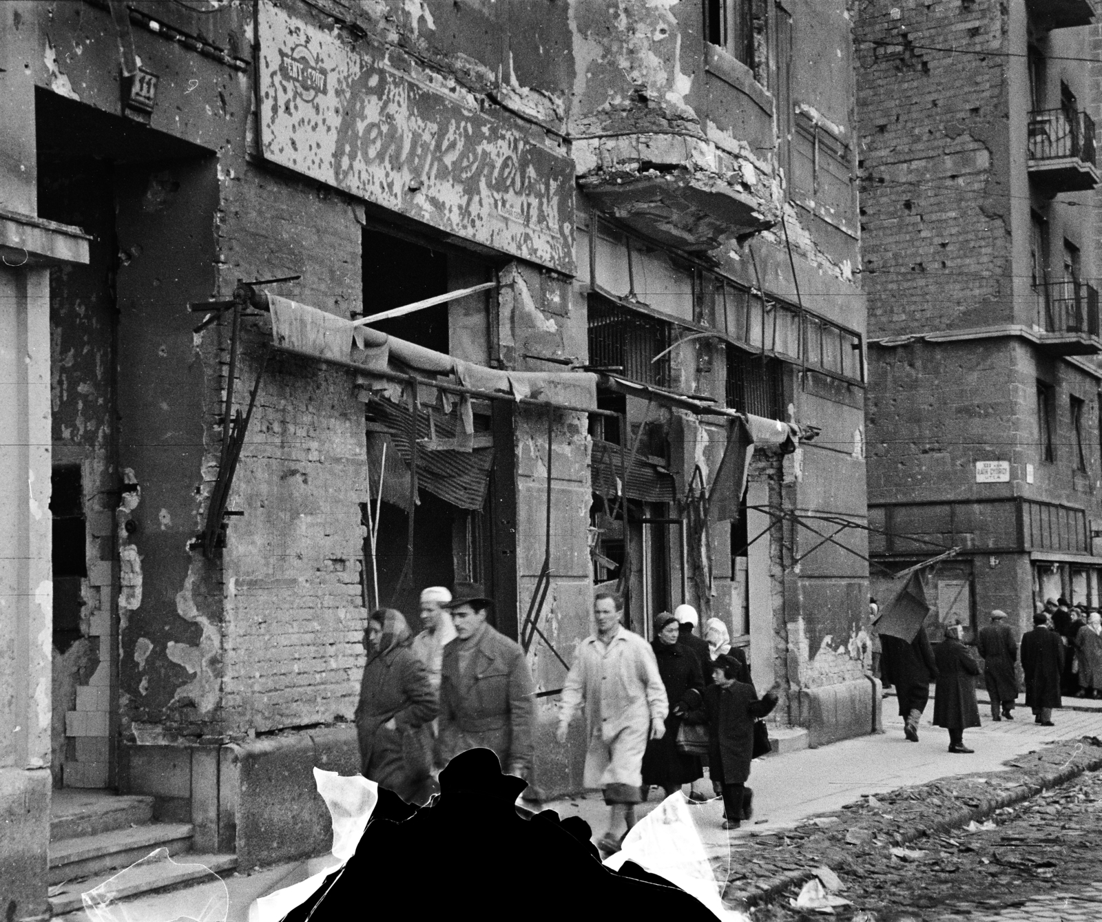 Hungary, Budapest XII., Alkotás utca, a felvétel a 11-es számú ház előtt a Ráth György utca torkolata közelében készült., 1956, Papp Dezső, pedestrian, bullet hole, street name sign, photographer, damaged photo, Budapest, Fortepan #272687