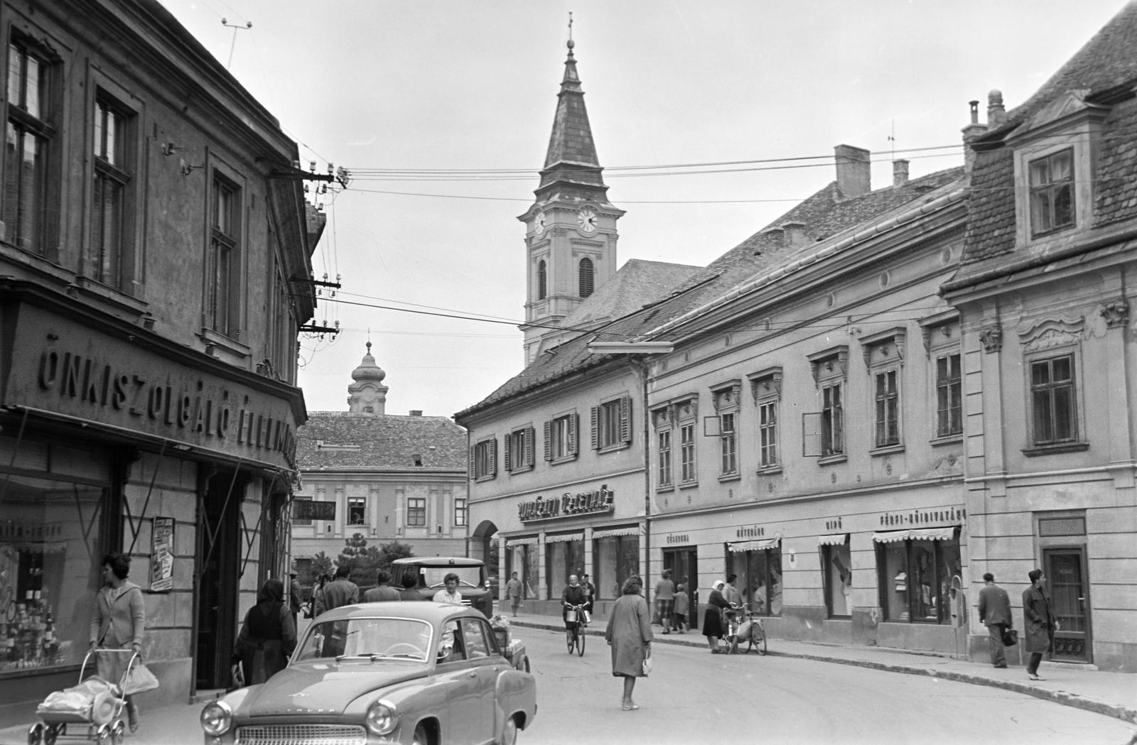 Hungary, Székesfehérvár, Liszt Ferenc utca, háttérben a Szent Imre-templom és távolabb a Nepomuki Szent János-templom egyik tornya látható., 1965, Gazda Anikó, Fortepan #307215