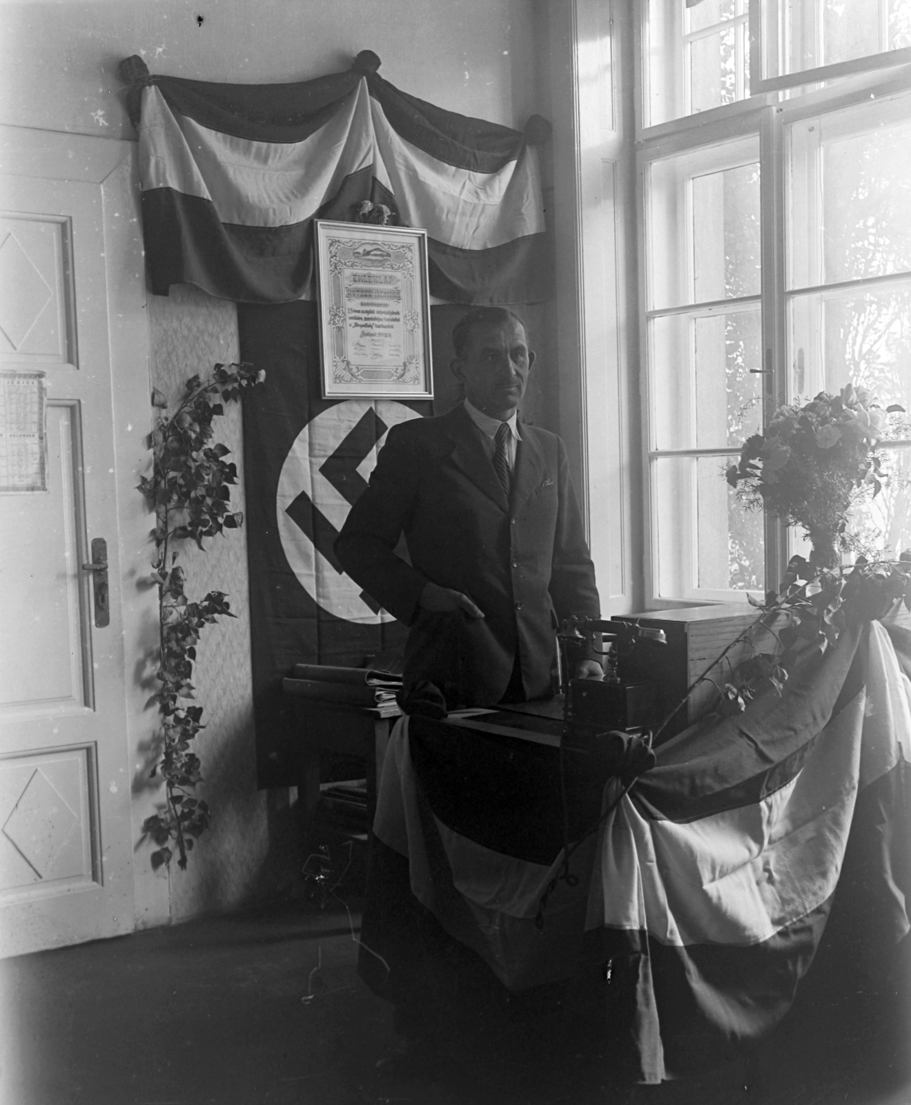 Hungary, 1938, Pálinkás Zsolt, portrait, flag, desk, swastica, telephone, flower, interior, man, warrant, backlight, Fortepan #31901