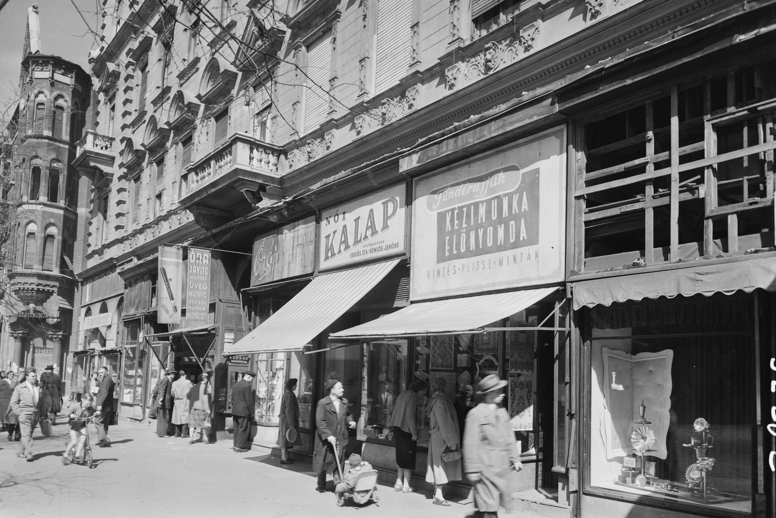Hungary, Budapest VII., Erzsébet (Lenin) körút páratlan oldala, a Barcsay utca torkolatával., 1957, UVATERV, sign-board, clockmaker, hat shop, Budapest, handcraft, Show window, Fortepan #3598