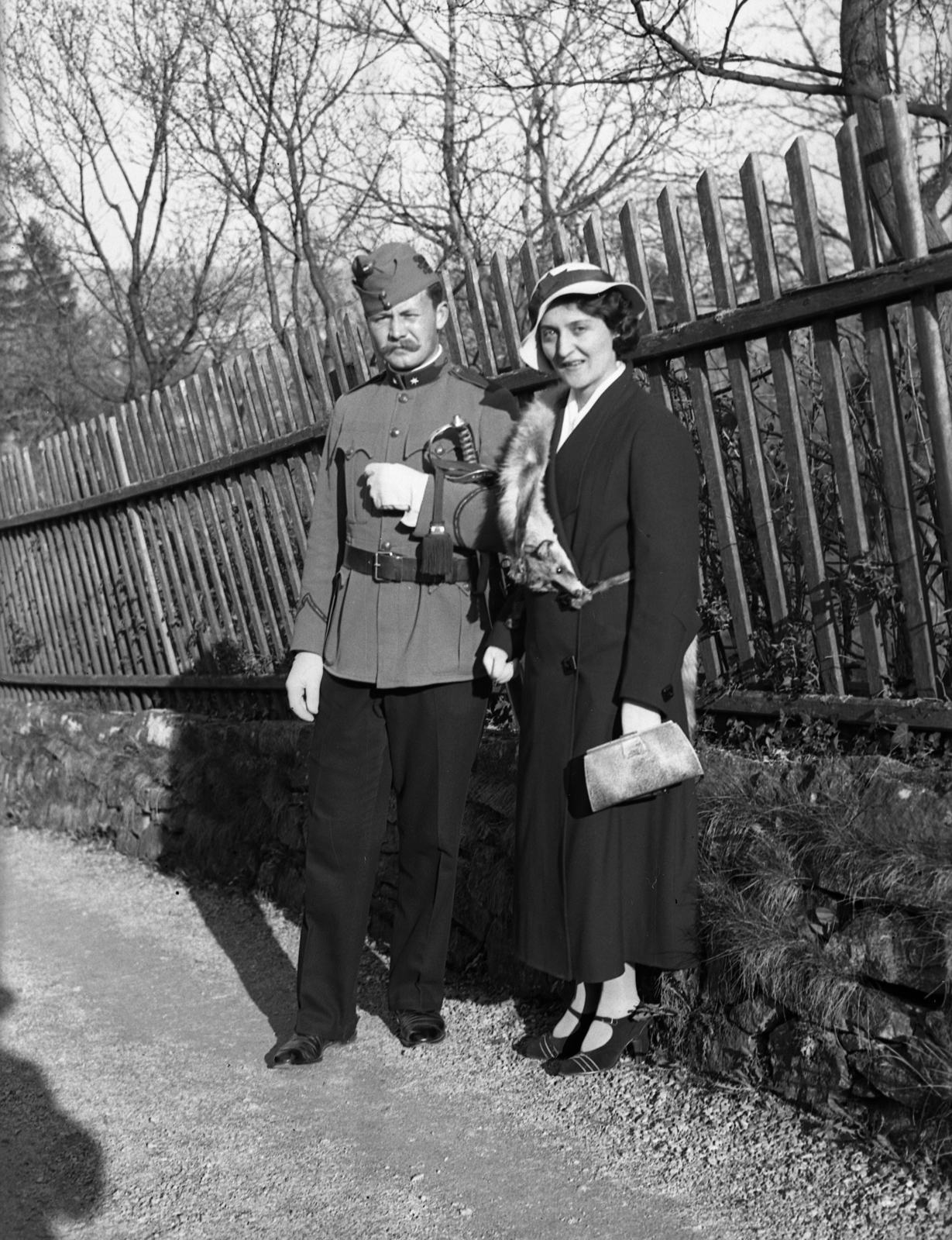 1935, Rados Tamás OSB, hat, uniform, man, fence, woman, sword, double portrait, chevron, officer, Fortepan #40425