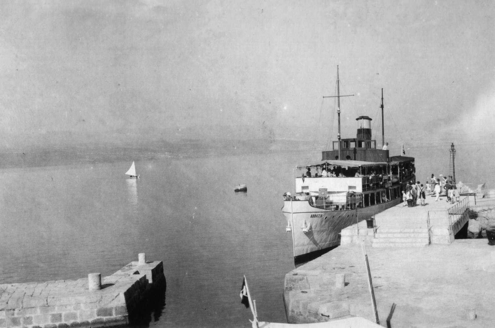 Croatia, Lovran, kikötő., 1930, MZSL/Ofner Károly, sailboat, flag, pier, mooring bollard, Abbazia ship, Fortepan #42362