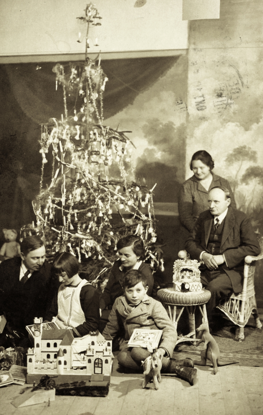 Hungary, Jászberény, 1937, Morvay Kinga, Christmas, kid, family, present, toy, grandparent, wicker chair, interior, Fortepan #45367