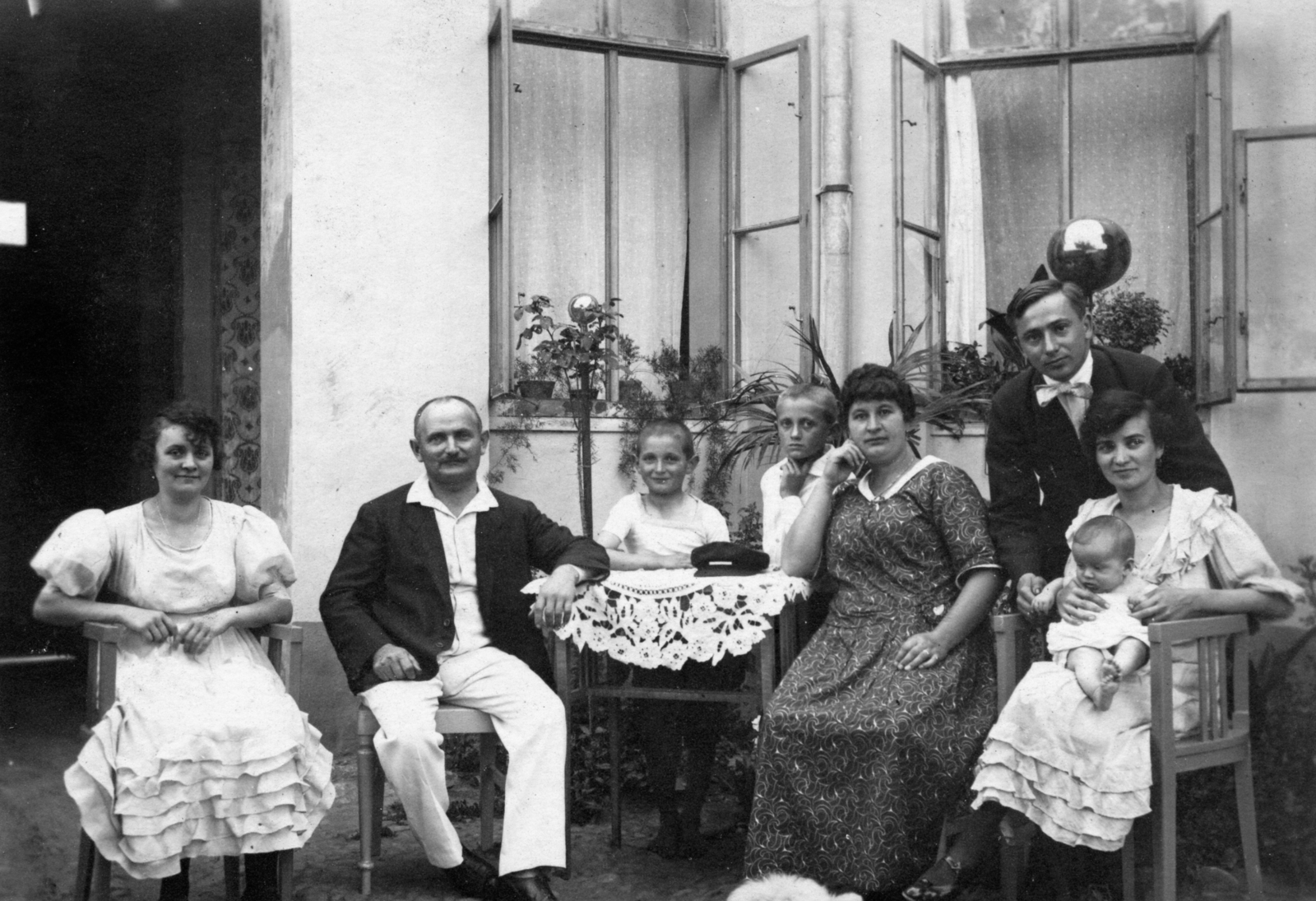 Romania,Transylvania, Salonta, strada Horea 10. udvara., 1935, Morvay Kinga, fashion, family, yard, tableau, women, men, furniture, summer, newborn, kids, sitting on lap, Fortepan #45695