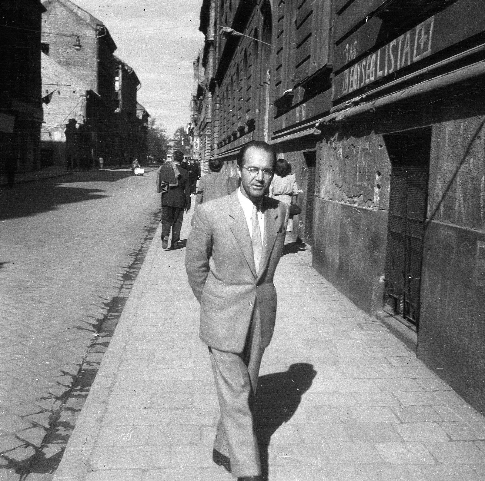 Hungary, Budapest VI., Szondi utca, jobbra a 81-85 sz., a távolban a Dózsa György út., 1947, Nagy Gyula, portrait, street view, glasses, man, Budapest, hands behind the back, Fortepan #54166