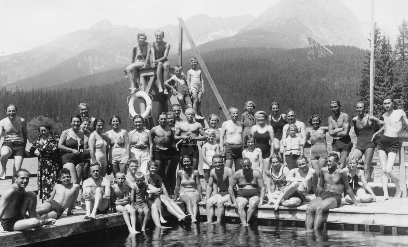 Slovakia,High Tatras, Strbské pleso, háttérben a Jarolímek síugró sánc., 1941, Góg Emese, woods, pool, bathing suit, tableau, lifebelt, ski-jump, muscle, tarn, Tatra Mountains, First Slovak Republic, Fortepan #56834