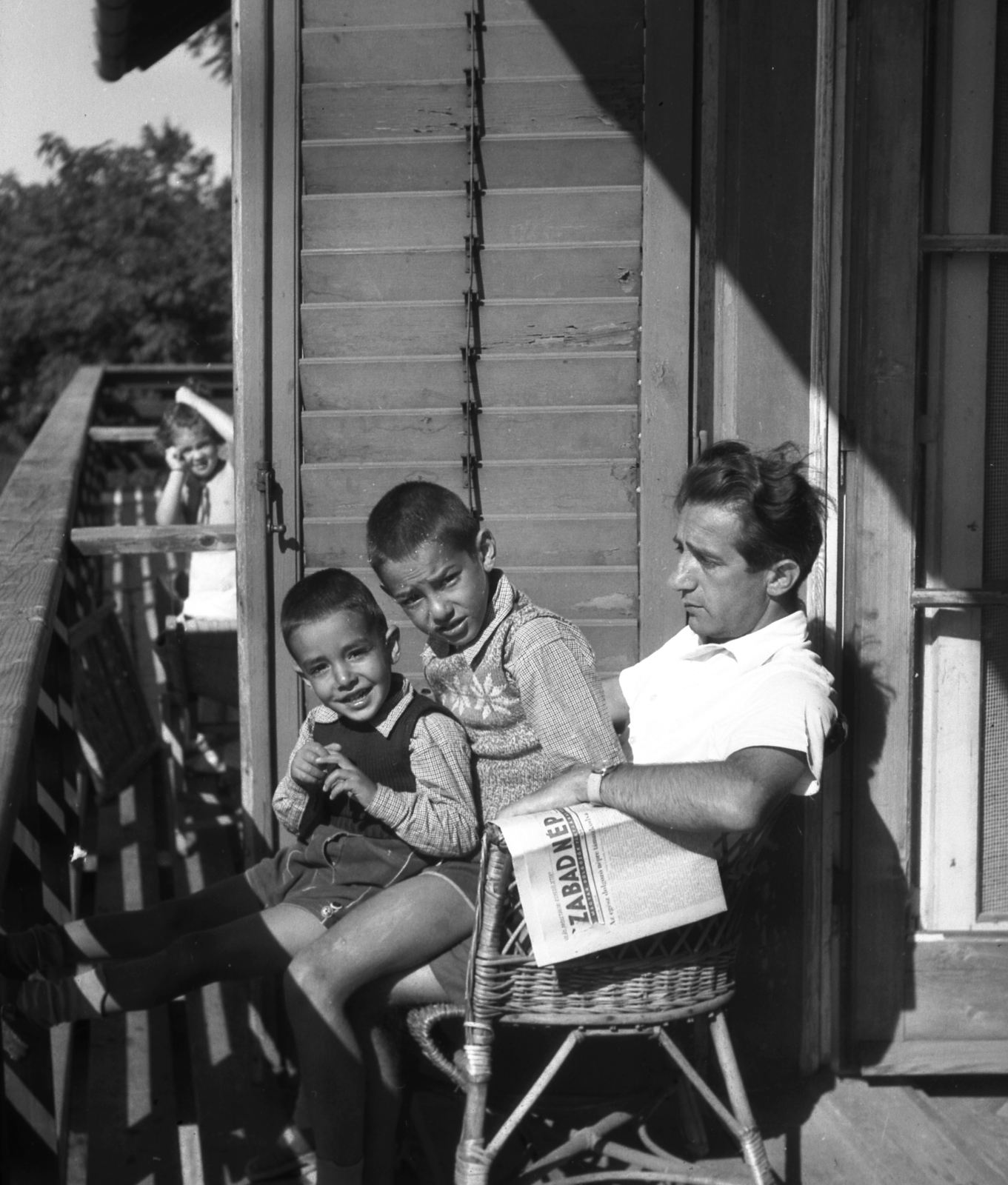 1953, A R, peeking, wicker chair, sunbathe, balcony, boys, newspaper, venetian blind, sitting on lap, Fortepan #62549