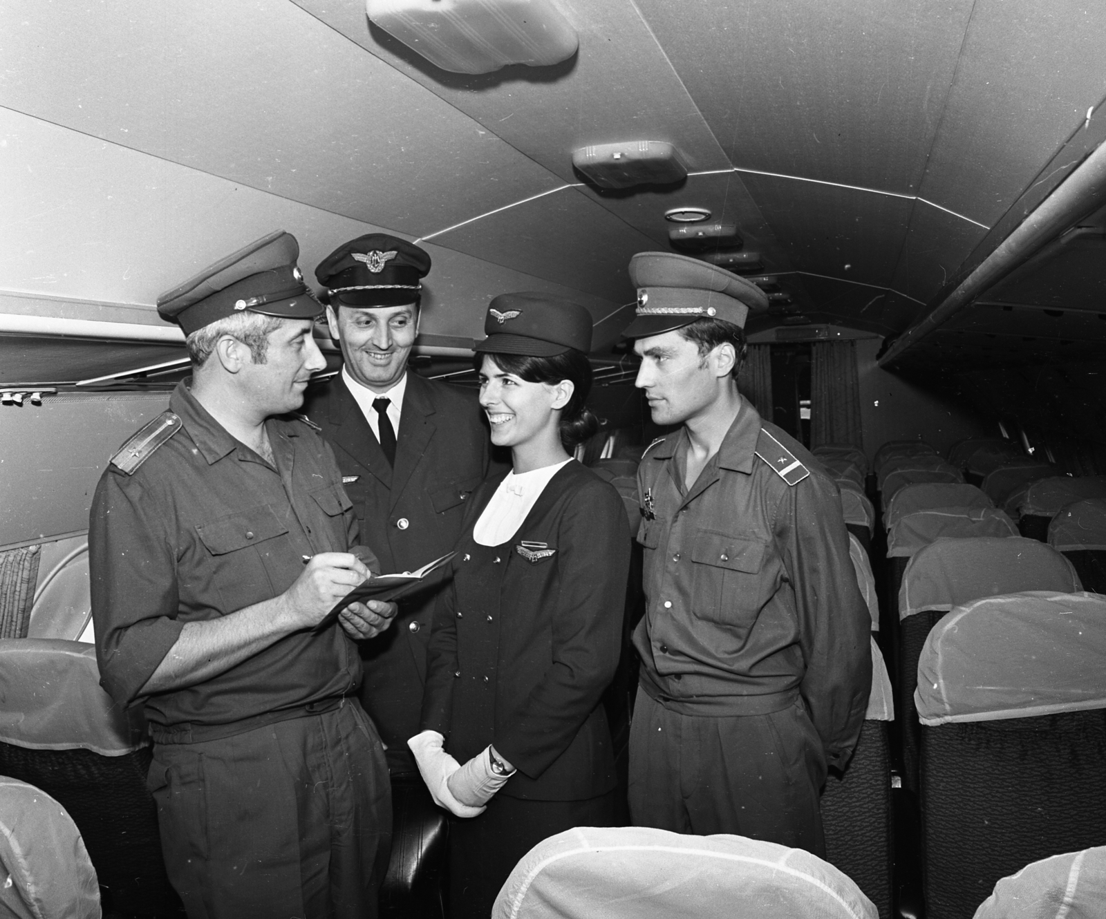 Hungary, Ferihegy (now - Ferenc Liszt) International Airport, Budapest XVIII., MALÉV IL-18-as repülőgép., 1971, Magyar Rendőr, pilot, airplane, flight attendant, Budapest, cabin crew, hands behind the back, Fortepan #65860