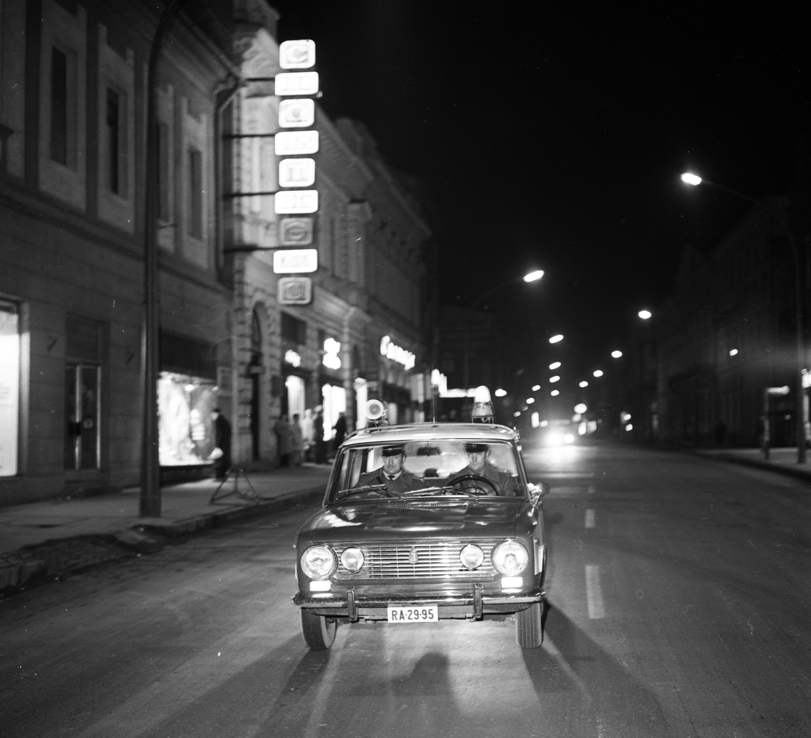 Hungary, Kaposvár, Fő utca a Kossuth tér felől nézve., 1974, Magyar Rendőr, Lada-brand, cop, night, peaked cap, number plate, police vehicle, foglights, Fortepan #66015