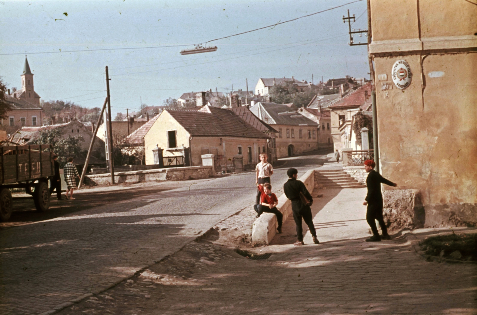 Hungary, Veszprém, Patak tér - Jókai Mór utca sarok a Séd hídja felé nézve., 1966, Herth Viktória dr, Bodó Emma, school, colorful, medical institution, street view, crest, pylon, public lighting, board, Fortepan #76505