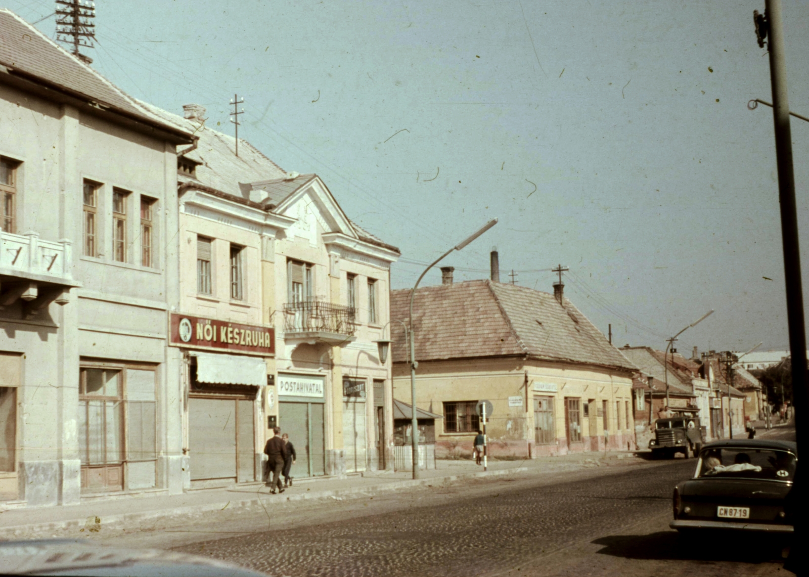 Hungary, Veszprém, Kossuth Lajos utca., 1968, Herth Viktória dr, Bodó Emma, colorful, commercial vehicle, street view, lamp post, hairdresser, post, automobile, number plate, clothing store, post office, Fortepan #76529