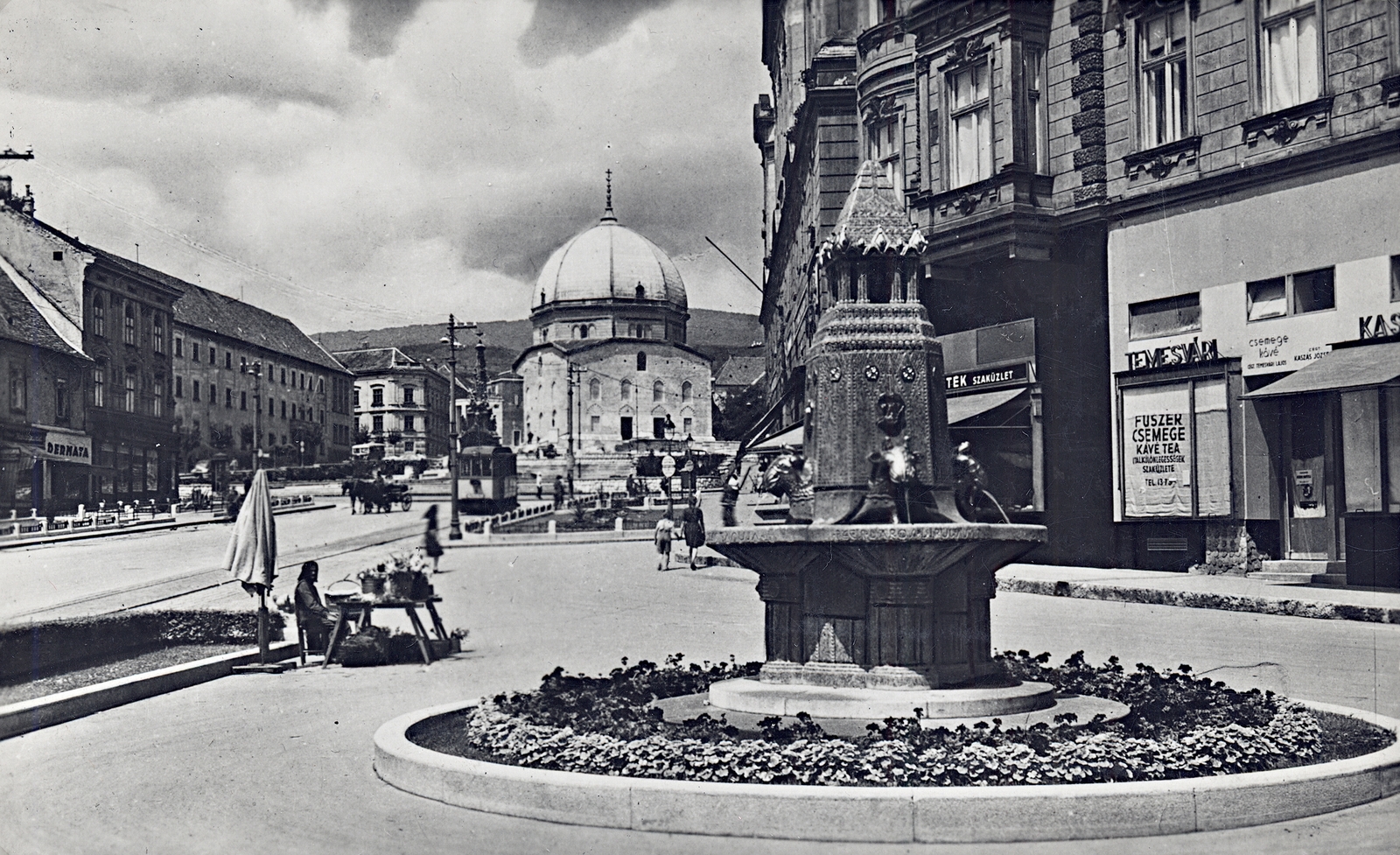 Hungary, Pécs, Széchenyi tér, Zsolnay-kút., 1940, Erky-Nagy Tibor, sunshades, tram, store display, florist, Horse-drawn carriage, church, dome, street view, Fortepan #76675