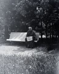 1915, Kurutz Márton, portrait, reading, glasses, newspaper, bench, lady, Fortepan #10330