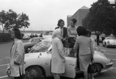 Hungary, Budapest XI., Műegyetem rakpart a Petőfi híd felé nézve., 1965, Hunyady József, street view, genre painting, trench coat, Porsche-brand, Budapest, sitting on a car, Fortepan #107378