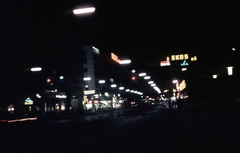 Ausztria, Bécs, a Landstrasser Hauptstrasse eleje az Am Stadtpark felől., 1961, Móra András, színes, este, neon felirat, Fortepan #115004