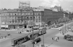 Magyarország, Budapest VI., Oktogon (November 7. tér)., 1952, Magyar Rendőr, autóbusz, cégtábla, teherautó, utcakép, életkép, jelzőlámpa, gyalogátkelő, neonreklám, villamos, hirdetőoszlop, dzsip, automobil, Skoda 1101/1102 Tudor, fényképész, Budapest, MASZOVLET légitársaság, GAZ 67, EMW-márka, EMW 340, Fortepan #16763