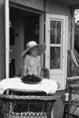 1949, Chuckyeager tumblr, girl, wicker chair, fruit, deck chair, garden furniture, straw hat, striped dress, Fortepan #175877