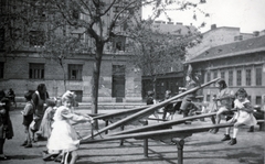 Hungary, Budapest VIII., a mai Molnár Ferenc tér, a háttérben a Práter utca., 1947, Ferencziné Fodor Katalin, seesaw, toy, Budapest, Fortepan #220140