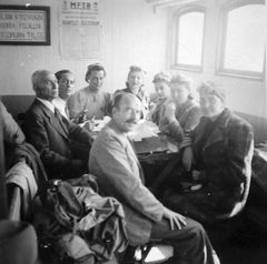 Hungary, Csavargőzös belső helyisége., 1941, Lakatos Mária, ship, tableau, moustache, interior, man, headscarf, lady, coat, schedule, Fortepan #22027