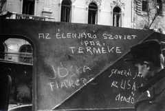 Magyarország, Budapest VIII., Üllői út, kiégett szovjet BTR-152 páncélozott lövészszállító jármű, háttérben 30. és 32. számú ház., 1956, Matthaeidesz Konrád, Budapest, forradalom, felirat, graffiti, Fortepan #224009