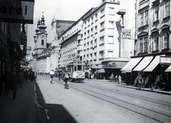 Austria, Linz, Landstraße, jobbra a Mozartstraße. Távolabb a Mihály arkangyal tiszteletére felszentelt Ursulinenkirche., 1933, Bor Dezső, bicycle, Fortepan #231353