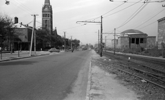 Hungary, Budapest VIII.,Budapest XIV., Kerepesi út, balra a Százados út torkolata és a Lisieux-i Szent Teréz-templom (Törökőri templom). Jobbra a metró és a gödöllői HÉV Hungária körúti, közös végállomása (később lebontásra került). Előtte az ekkor a Keleti pályaudvarig közlekedő HÉV vonala. A felvétel a 3-as főút szélesítéséhez kapcsolódó sorozat része., 1961, FŐMTERV, Budapest, Fortepan #251561