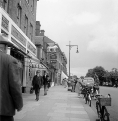 United Kingdom, High Street 24-26., Mitre House., 1948, UWM Libraries, bicycle, street view, label, pedestrian, street lamp, lion, pavement, Fortepan #258890