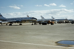 Oroszország, Moszkva, Vnukovói repülőtér., 1959, UWM Libraries, Harrison Forman, teherautó, tartálykocsi, Aeroflot légitársaság, repülőgép, repülőtér, színes, Tupoljev-márka, Iljusin-márka, Kraz-márka, Iljusin IL-18, Tupoljev Tu-104, Fortepan #259816