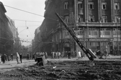 Magyarország, Budapest VIII.,Budapest IX., Kálvin tér az Ülli út felé nézve., 1956, Papp Dezső, utcakép, felsővezeték, villamos, villanyoszlop, villamossági szaküzlet, divatáru, Budapest, forradalom, ferde, Fortepan #272722