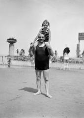 Hungary,Lake Balaton, Siófok, strand., 1921, Gara Andor, bathing suit, sitting on the shoulders, Fortepan #285135