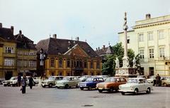 Hungary, Győr, Széchenyi tér, szemben a Xantus János Múzeum (Apátúr ház), jobbra Buda 1686. évi visszafoglalásának emlékére állított Mária oszlop, jobb szélen a Rába Városi Művelődési Központ (egykori Lloyd székház, ma irodaház)., 1977, Kozák, number plate, Fortepan #286772