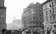 Magyarország, Budapest VIII.,Budapest VII., Rákóczi út a Kenyérmező utcától a Szövetség utca felé nézve., 1956, Nagy Gyula, háborús kár, forradalom, teherautó, utcanévtábla, Budapest, épületkár, Fortepan #40156