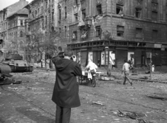 Hungary, Budapest VIII., József körút - Corvin (Kisfaludy) köz sarok. A triciklin Vén István forradalmár, aki a sebesültszállításban vett részt a környéken., 1956, Nagy Gyula, war damage, Soviet brand, revolution, tank, tricycle, wreck, photography, untitled, Csemege enterprise, Budapest, damaged building, Fortepan #40263