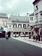 Magyarország, Győr, Baross Gábor út torkolata a Király utcába., 1939, Konok Tamás id, kerékpár, színes, cégtábla, utcakép, városkép, életkép, fodrászat, cégér, Fortepan #42694