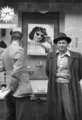 Hungary, Budapest, 1956, Berényi Márta, ad, hat, Show window, men, glasses, shades, thermometer, padlock, hands behind the back, Fortepan #58166